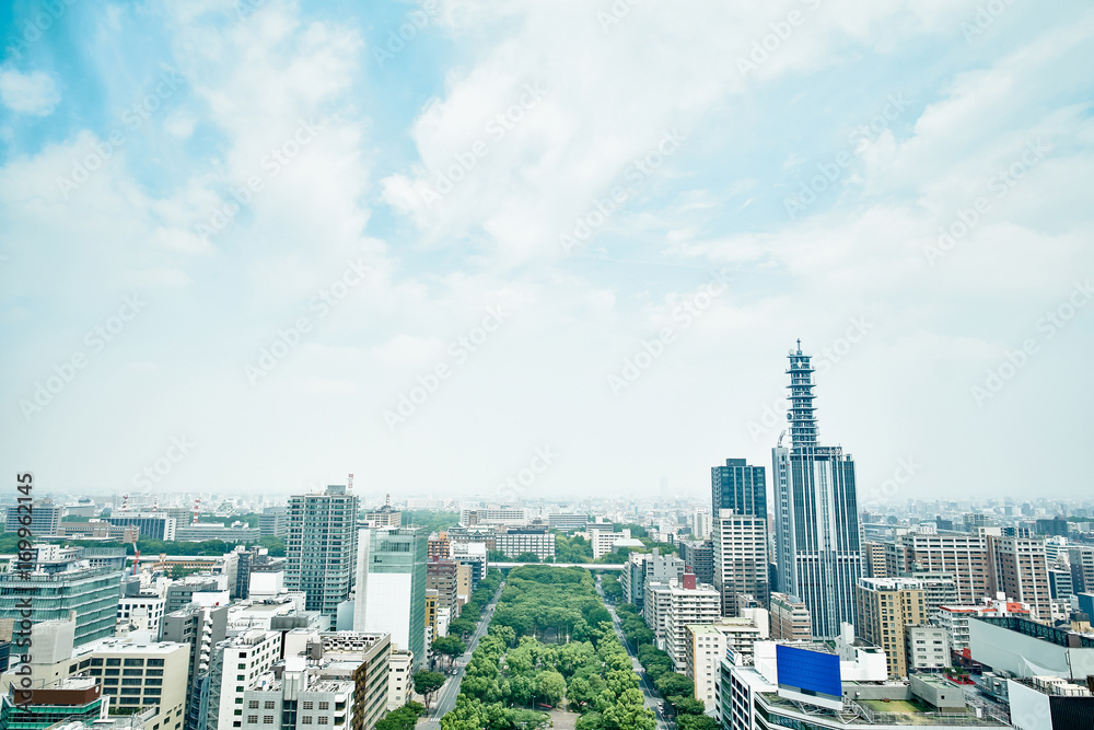 Fototapeta premium Business concept for real estate and corporate construction - panoramic modern city skyline bird eye aerial view under dramatic cloud and morning bright blue sky on Nagoya TV Tower in Nagoya, Japan