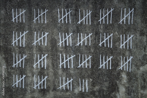 counting days in prison -  handwritten lines of white chalk