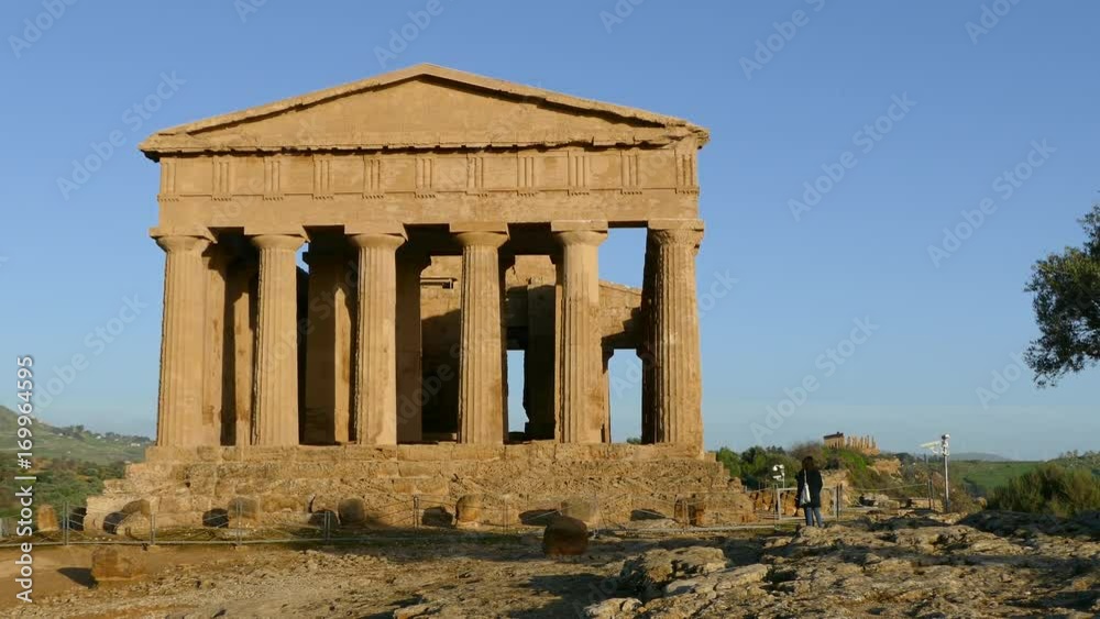 Tourists walking around the Temple of Juno a 5th-century BCE Greek temple Tourists walking around the Temple of Juno a 5th-century BCE Greek temple