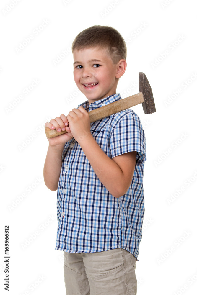 Happy kid in blue checkered shirt holding hammer and smiling against white background Happy kid in blue checkered shirt holding hammer and smiling against white background