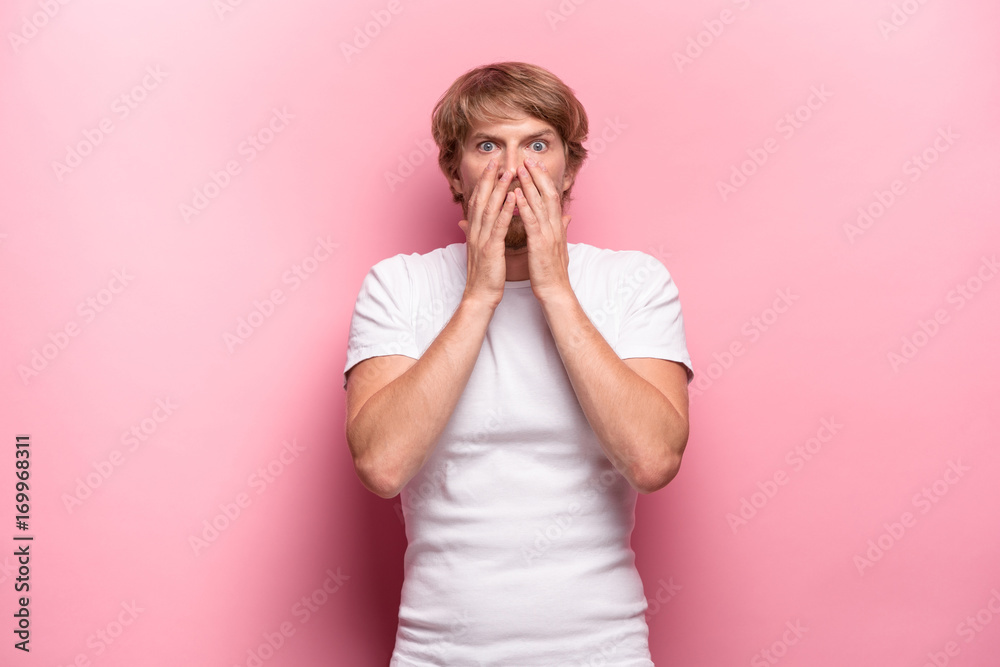 Portrait of young man with shocked facial expression Portrait of young man with shocked facial expression