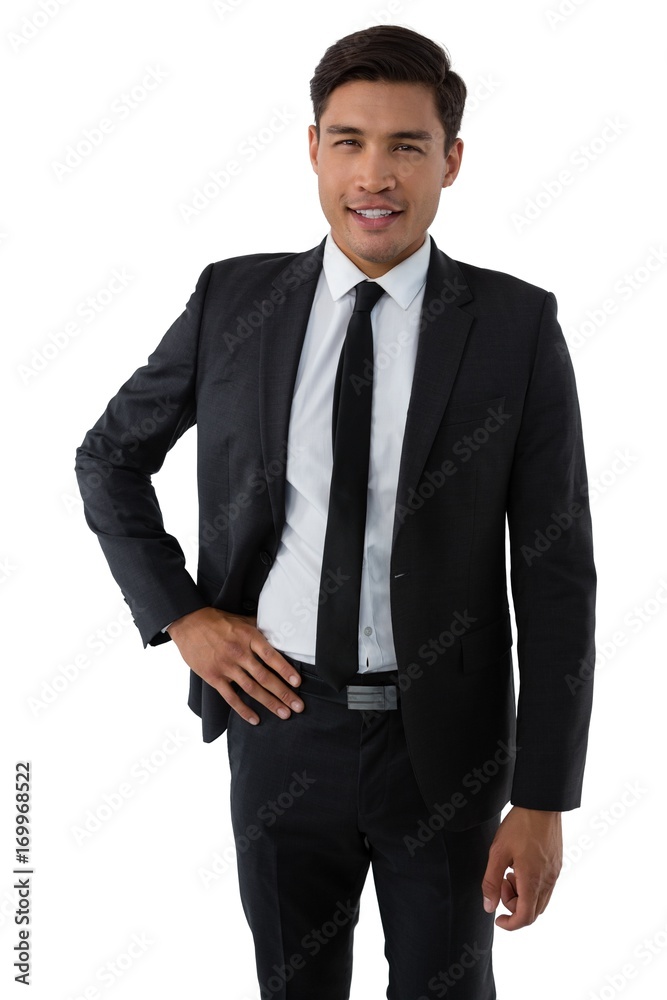 Portrait of smiling young businessman with hand on hip Portrait of smiling young businessman with hand on hip