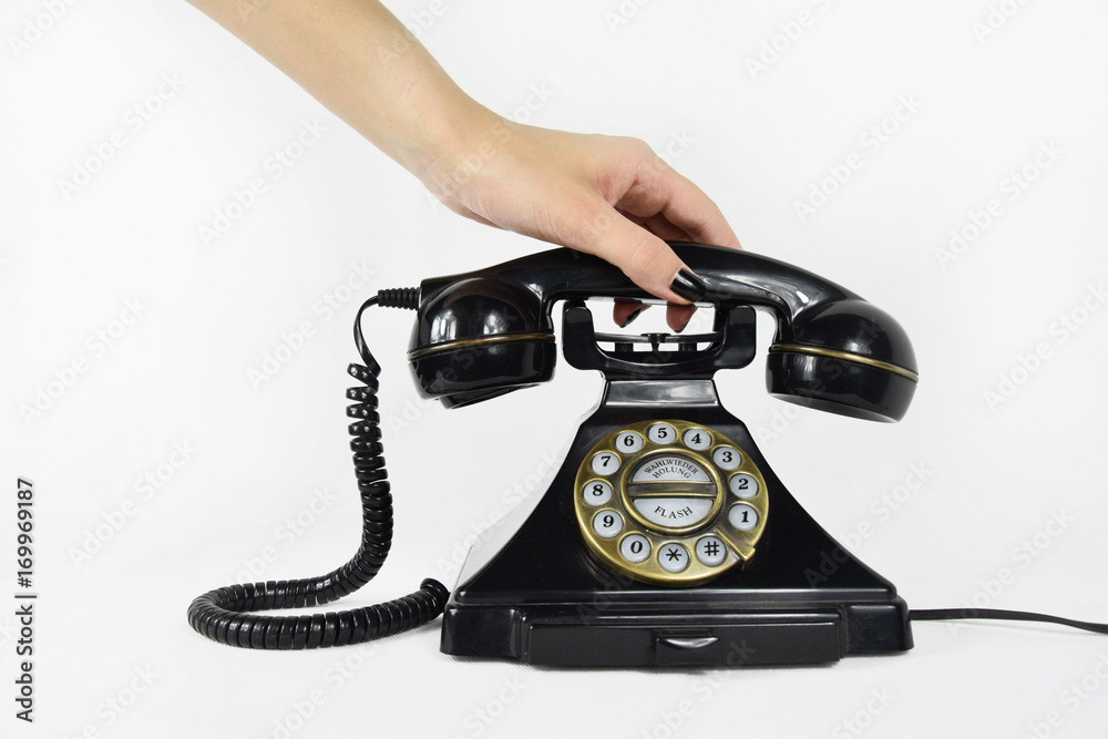 Reaching for the Receiver of a Vintage Telephone
