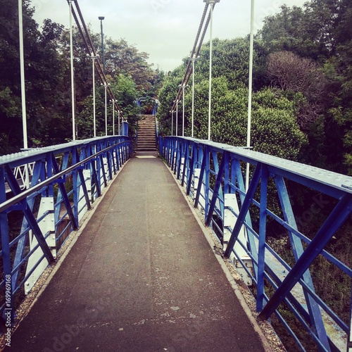 Blue bridge on the river photo