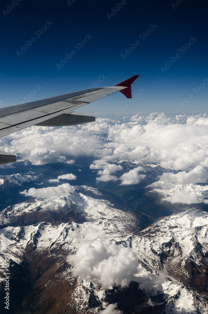 Obraz premium Austrian Alps mountains seen from an airplane window