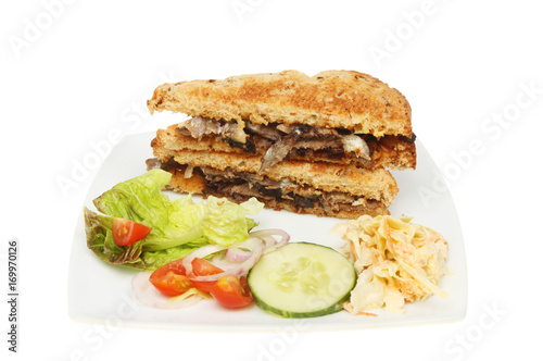 Toaste beef sandwich with salad