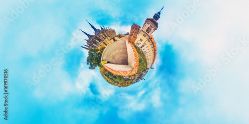 Foto Orange little planet panorama with cathedrals and cyan sky