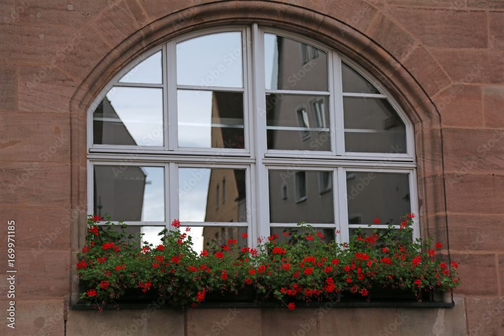 Balcony with windows and flowers