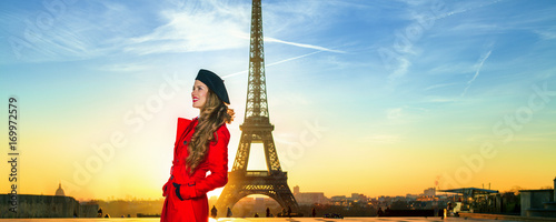 happy tourist woman against Eiffel tower in Paris, France