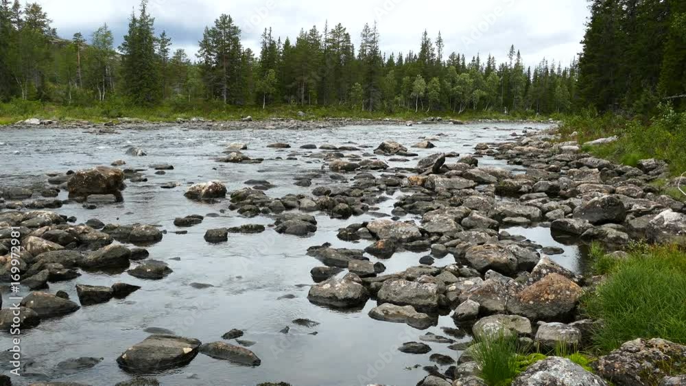 River at low tide full of rocks in Borgefjell National Park Norway River at low tide full of rocks in Borgefjell National Park Norway