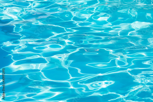 background surface of blue water in swimming pool