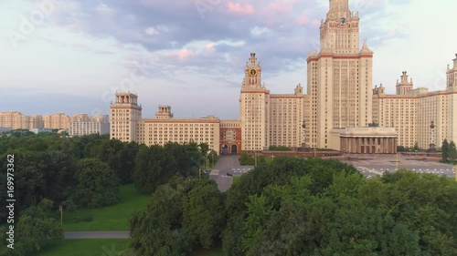 Moscow State University in summer. Russia. Flying from trees to panoramic view. Aerial view.