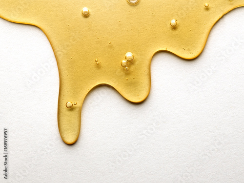 Close up of honey dripping photo