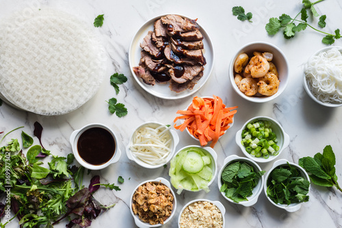 vietnamese rice wraps ingredients, with pork and shrimp and fres photo