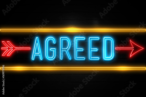 Agreed  - fluorescent Neon Sign on brickwall Front view