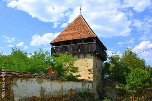 Ruins. Fortified medieval saxon evangelic church in the village Cobor, Transylvania, Romania. The settlement was founded by the Saxon colonists in the middle of the 12th century photo