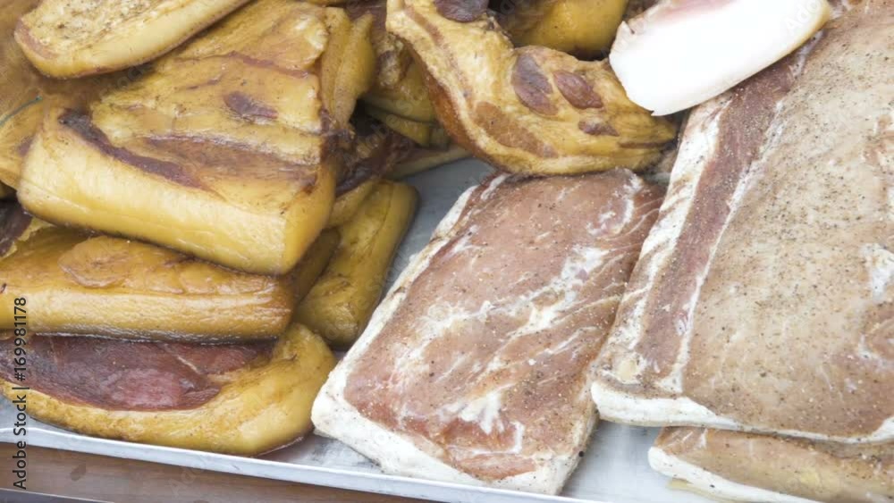 Various meat delicacies on the market showcase. Bacon. Sausage. Salami. Ham. Smoking. Various meat delicacies on the market showcase. Bacon. Sausage. Salami. Ham. Smoking.
