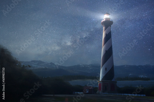 Obraz na plátně A lighthouse under night sky