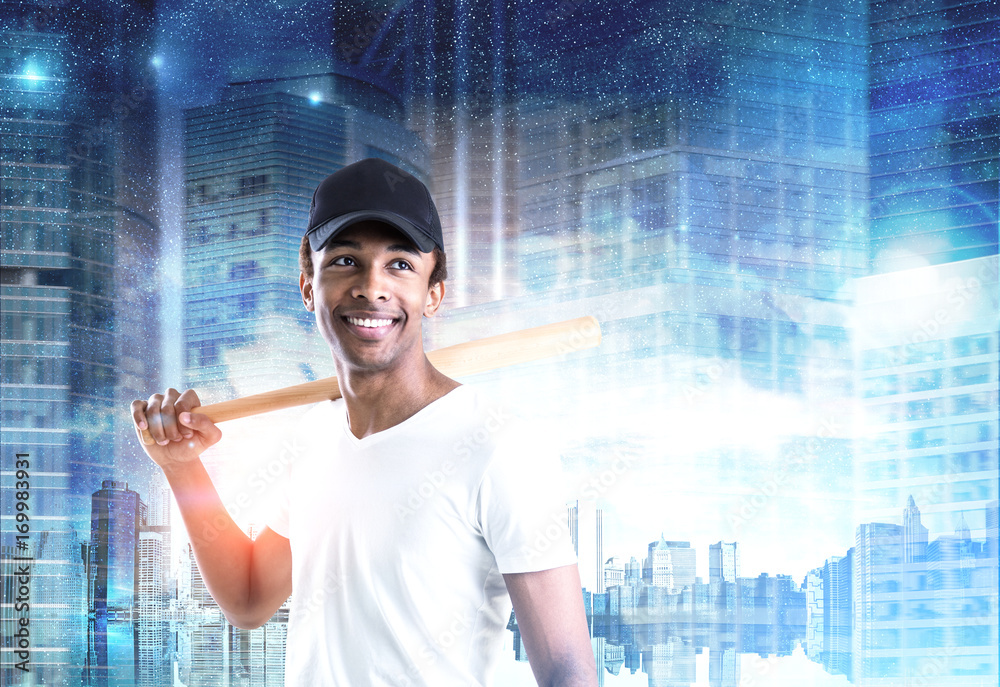 Smiling African American guy with bat, night city Smiling African American guy with bat, night city