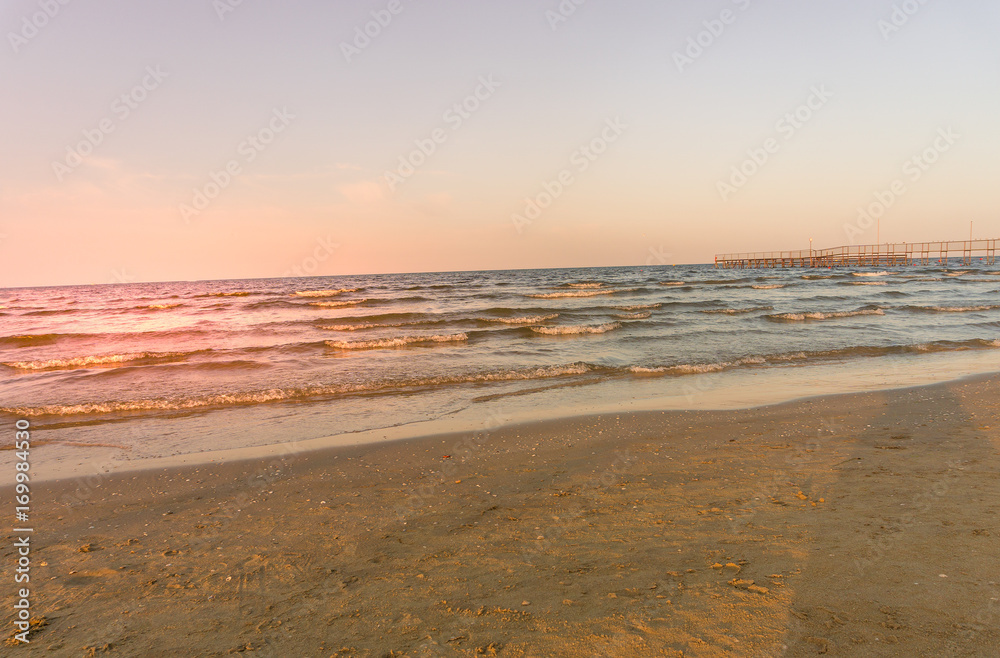 Obraz premium beach and sea at sunset, summer vacation at the sea