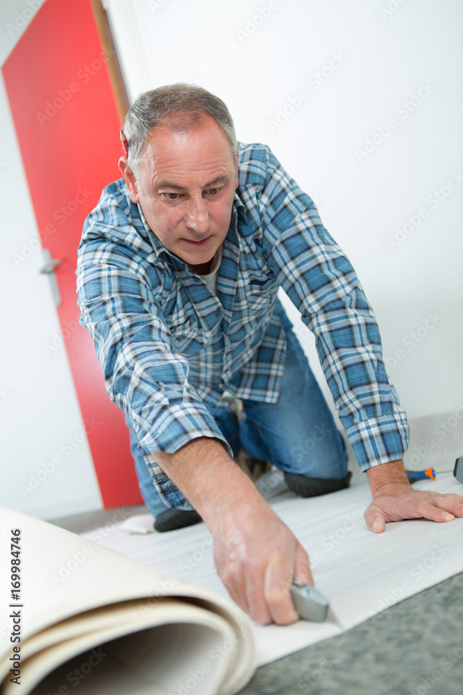 caucasian man cutting a cardboard box with sharp steel caucasian man cutting a cardboard box with sharp steel
