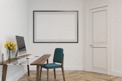White home office with a framed poster  side