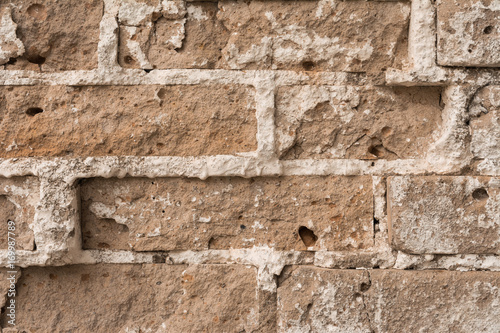 texture of an old ruined brick wall of an ancient building