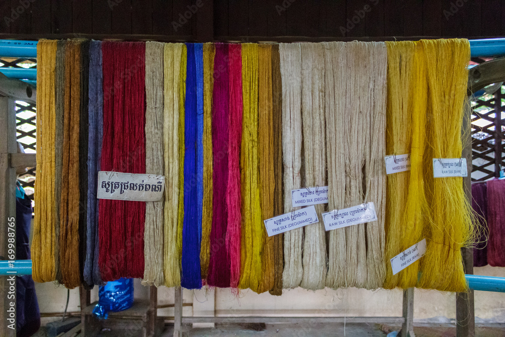 Obraz premium Colored silks hang from pipe in Siem Reap, Cambodia