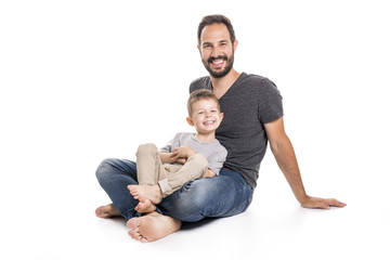 Father and son having fun over white background