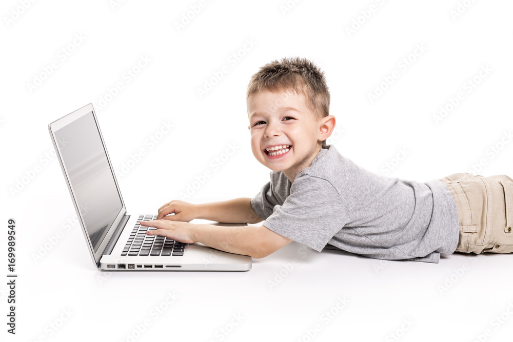little kid with laptop lay on the ground little kid with laptop lay on the ground
