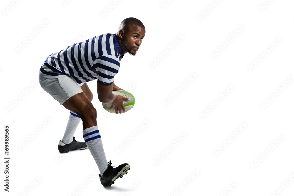 Full length of young athlete playing rugby
