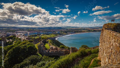 Bild auf Leinwand A wide angle shot of the Scarborough Castle, beach and old town in North Yorkshi