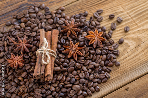 Background texture of grains of coffee cinnamon and anise stars