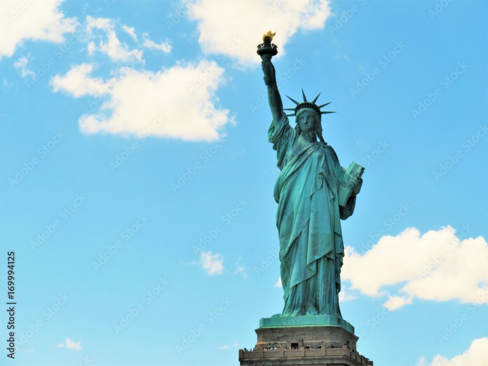 Fototapeta premium The Statue of Liberty in New York City with a blue sky background