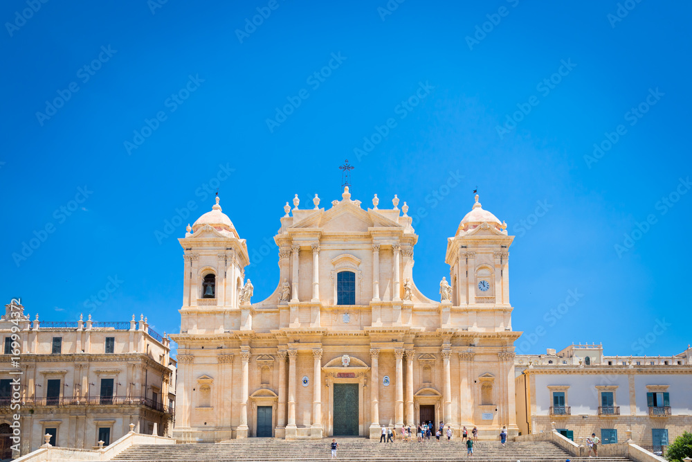NOTO, ITALY - 21th June 2017: tourists in front of San Nicolò Cathedral, UNESCO Heritage Site