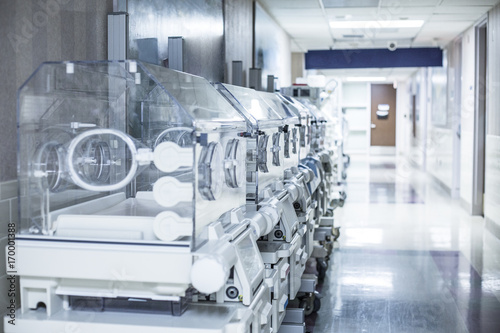 Newborn infant incubator boxes in a hospital corridor  photo