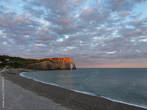 A beautiful sunrise at Etretat beach photo