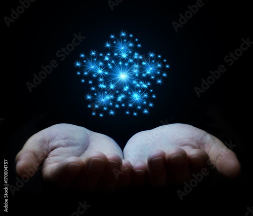 Hands holding star.