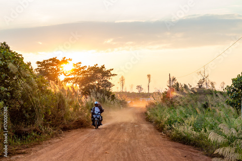 Red ground and dust on the rural road in Cambodia