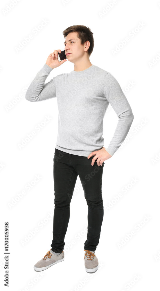 Cute teenage boy with mobile phone on white background Cute teenage boy with mobile phone on white background
