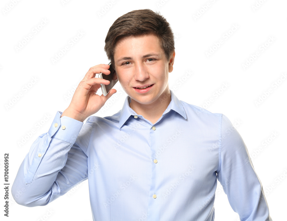 Cute teenage boy with mobile phone on white background Cute teenage boy with mobile phone on white background