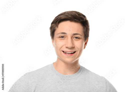 Cute teenager boy posing on white background © Africa Studio