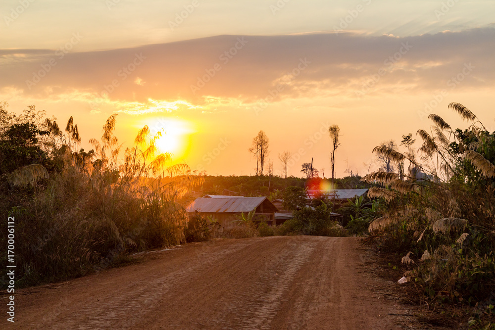Red ground and dust on the rural road in Cambodia