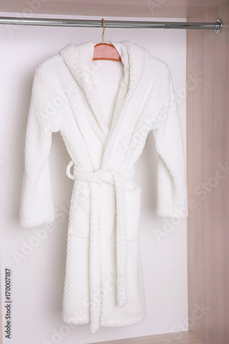 Bathrobe hanging in wardrobe