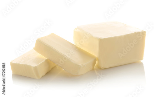Cut block of butter isolated on white