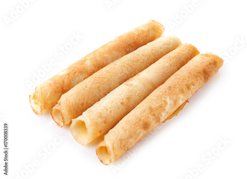 Rolled thin pancakes isolated on white