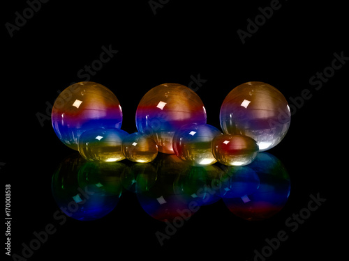 Colored glass shapes on a black background. Illustration