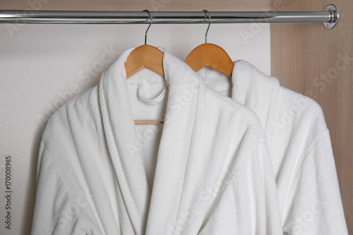 Bathrobes hanging in wardrobe