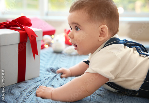 Cute little baby and gift b...