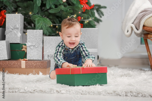 Cute little baby with giftb...
